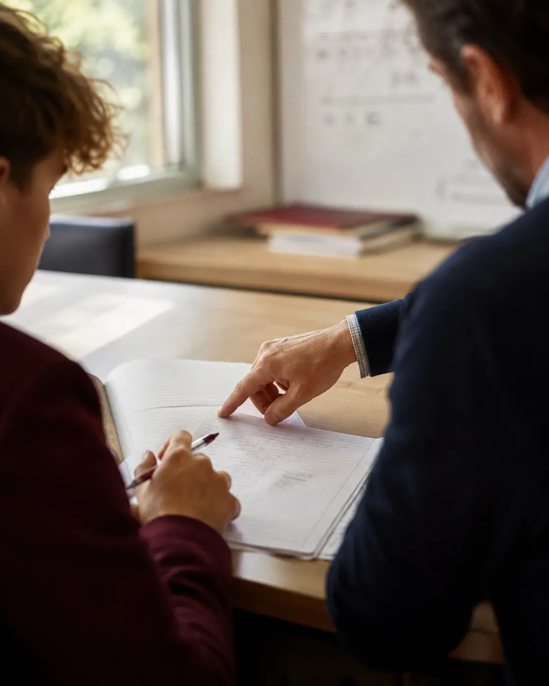 An educator providing one-to-one guidance during a study session