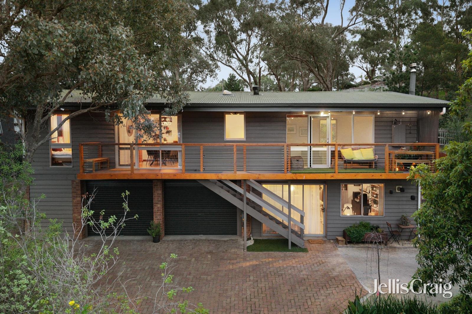 Exterior of 4 Elgata Court, Diamond Creek, showing the veranda and leafy surrounds